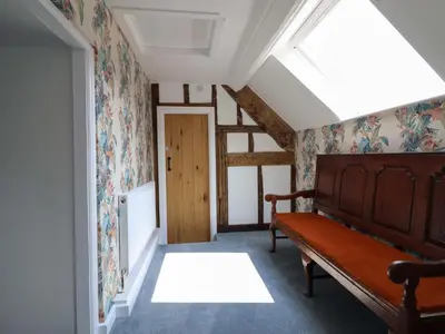 a room with a bed and a skylight at Upper Dolarddyn in Welshpool