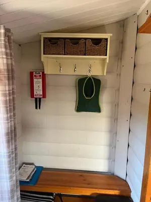 a bench in a tiny house at Home From Home LogCabin in Trawsfynydd