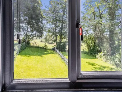 a window with a view of a field of grass at Sheep Shed - Uk49794 in Cribyn