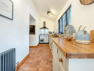 a kitchen with a counter and a large window at Shire - Uk49791 in Cribyn