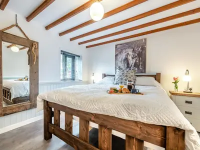 a bedroom with a bed with a tray of fruit on it at Shire - Uk49791 in Cribyn