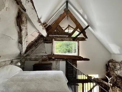 a bedroom with a bed and a window at Croft Lodge Studio in Leominster