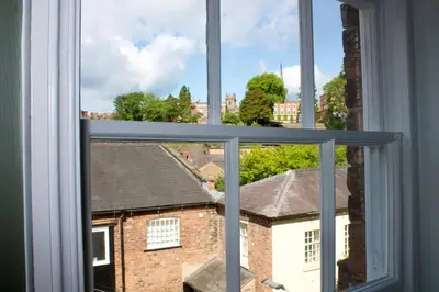 a window with a view of a brick building at English Bridge Court in Shrewsbury