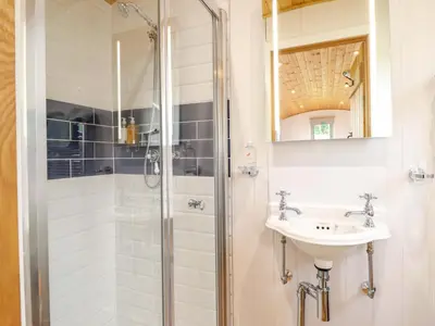 a bathroom with a shower and a sink at Cheviot in Oswestry