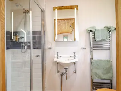 a bathroom with a sink and a shower at Cheviot in Oswestry