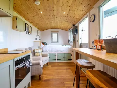 a kitchen and living room in a tiny house at Charollais in Oswestry
