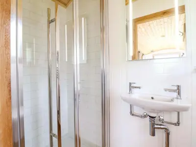 a bathroom with a sink and a shower at Defaid Cymreig in Oswestry