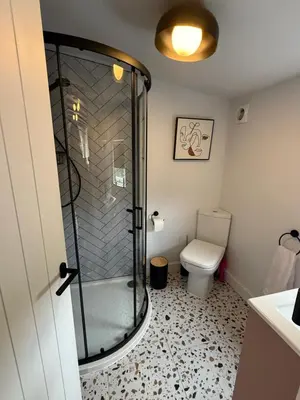 a bathroom with a shower and a toilet at Robins' Rest - 22 Caer Beris Luxury Lodge Park NEW Sleeps 6 Riverside Reteat in Builth Wells