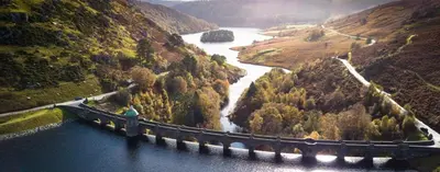 a bridge over a river in the middle of a mountain at Robins' Rest - 22 Caer Beris Luxury Lodge Park NEW Sleeps 6 Riverside Reteat in Builth Wells