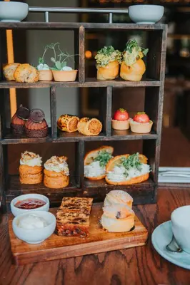 a display of pastries and cakes on a shelf at Ty Glyn Hotel in Ciliau-Aeron