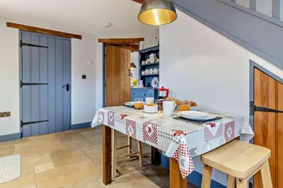 a kitchen with a table with a table cloth on it at 2 Bed in Pentre Bach oc-b30875 in Pentre-bâch