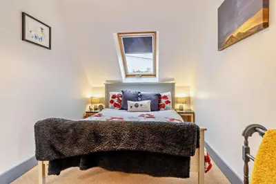 a bedroom with a bed and two night stands at 2 Bed in Pentre Bach oc-b30875 in Pentre-bâch