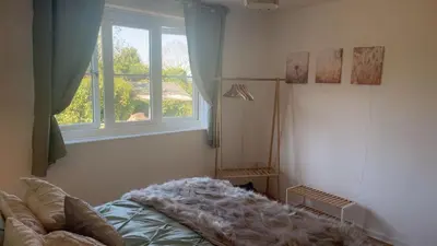 a bedroom with a bed and a window at Mountain View, Brecon Beacons