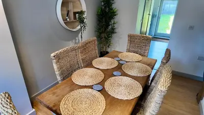 a wooden table with straw hats on top of it at Zest Homes 87a Bridge Street in Leominster