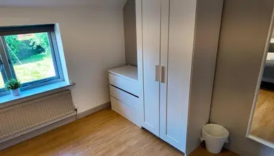 a room with a white cabinet and a window at Zest Homes 87a Bridge Street in Leominster