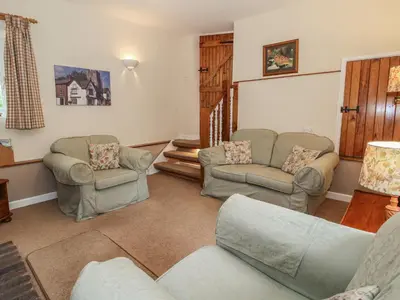 a living room with two chairs and a couch at Little Barn in Oswestry