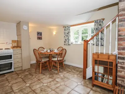 a kitchen and dining room with a table and chairs at Little Barn in Oswestry