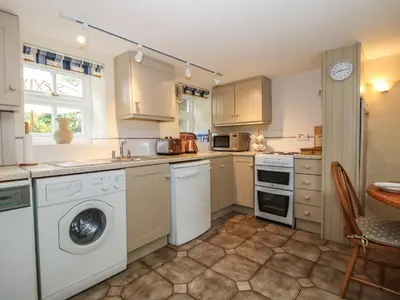 a kitchen with a washer and dryer at Little Barn in Oswestry