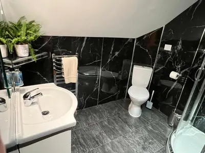 a bathroom with a sink and a toilet at One-Bedroom Cottage in Snowdonia National Park in Dolgellau