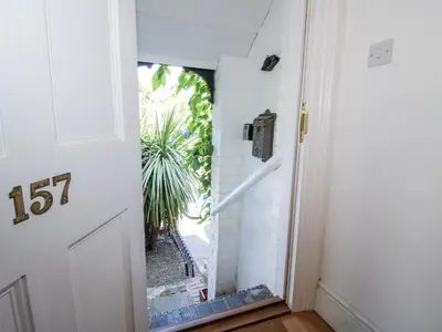a door with a glass window in a hallway at 157 Watling Street South in Church Stretton