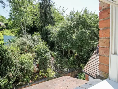 a view of a garden from the window of a house at 157 Watling Street South in Church Stretton