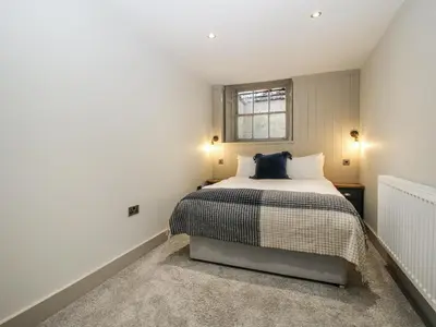 a bedroom with a bed and a window at 1C College Hill in Shrewsbury