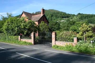a house on the side of a road at Outstanding Llangollen Riverside Apartment in Llangollen