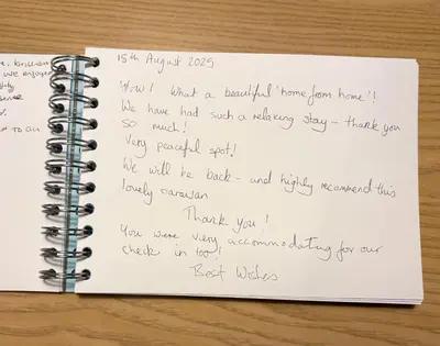 a notebook with a letter written in handwriting at Sanderling, 289 Ynyslas Beach, Borth in Borth