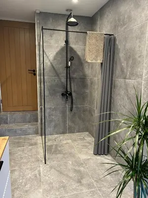a shower with a glass door in a bathroom at Builth wells stay in Builth Wells