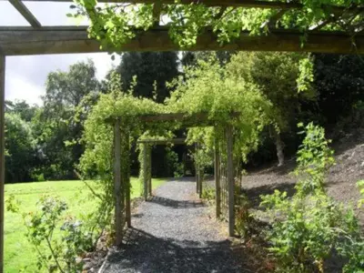 an entrance to a garden with an archway at Caer Beris Hotel in Builth Wells