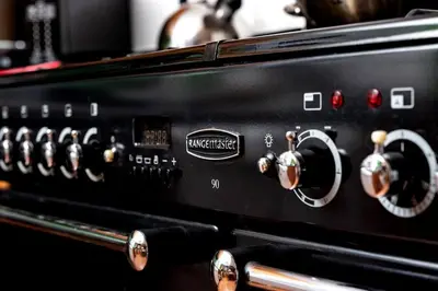 a close up of the knobs of a toaster oven at Cae Madog Barn in Llanbrynmair