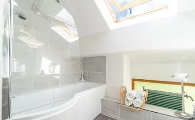 a bathroom with a shower and a bath tub at Y Pandy in Pennal