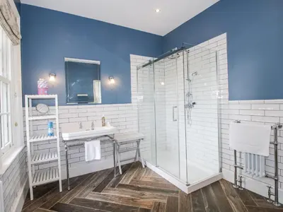 a bathroom with a sink and a shower at The Old Vicarage in Leominster