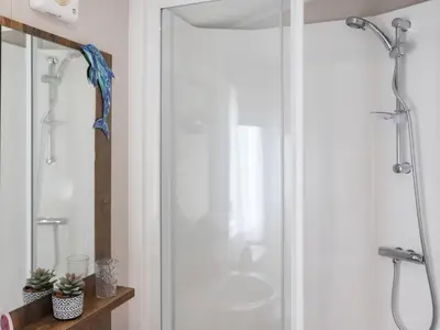 a shower in a bathroom with a glass door at The Laughing Seagull - Uk50213 in Aberystwyth