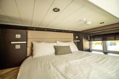 a bedroom with a bed in the middle of it at Daverneithon 1 in Rhayader