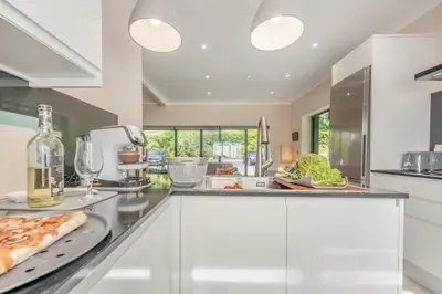 a kitchen with a counter with food and wine glasses at 2 Bed in Llanybydder oc-b32255 in Cwrt-newydd