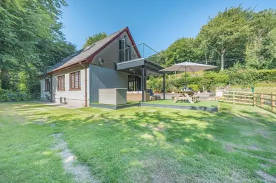 a home with a large yard with a house at 2 Bed in Llanybydder oc-b32255 in Cwrt-newydd