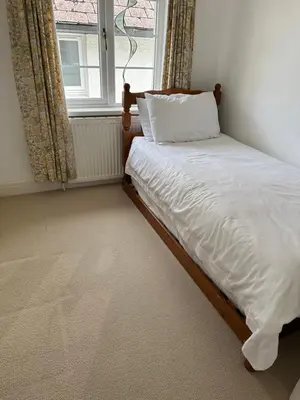 a bed in a room with a window at Brecon with Spectacular Views in Brecon
