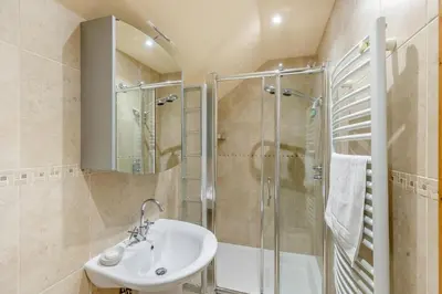 a bathroom with a sink and a shower at 4 Bed in Talybont oc-y32384 in Talybont