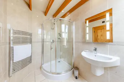 a bathroom with a shower and a sink at 4 Bed in Talybont oc-y32384 in Talybont