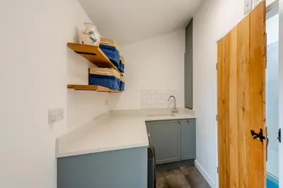 a kitchen with a sink and a counter top at 3 Bed in Tywyn oc-b32570 in Llangelynin