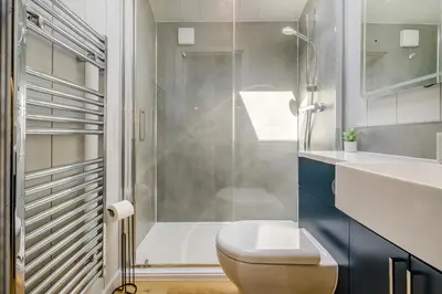 a bathroom with a shower and a toilet and a sink at 2 Bed in Cemmaes oc-a32660 in Cemmaes