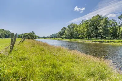 a river in a field with grass and trees at 2 Bed in Cemmaes oc-a32660 in Cemmaes