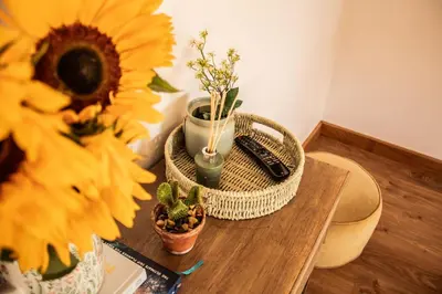 a table with sunflowers and a phone on it at Wyns Barn in Rhayader