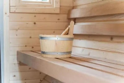 a bucket sitting on a shelf in a tiny house at Starry Nights Escape - Hot Tub & Sauna in Yarpole