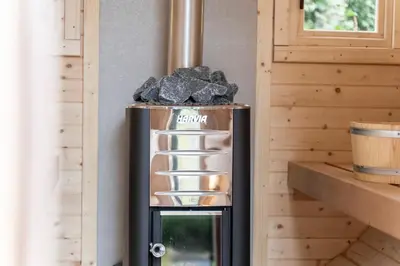 a small refrigerator with rocks on top of it at Starry Nights Escape - Hot Tub & Sauna in Yarpole