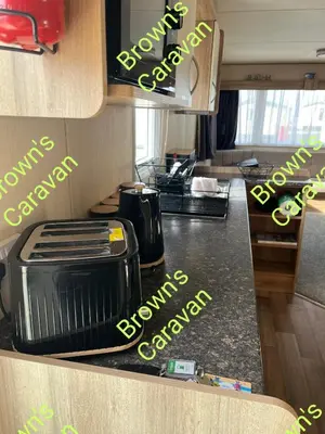 a kitchen with a counter top with a toaster at Browns 137 Snowdon Summit 099 in Barmouth