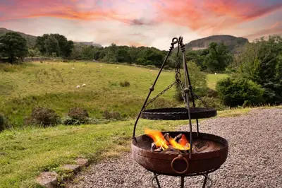 a fire in a pot on the side of a road at Finest Retreats - Penclogwynau in Dolgellau