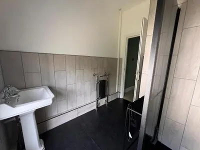 a bathroom with a sink and a mirror at Cilgwyn Manor in Myddfai