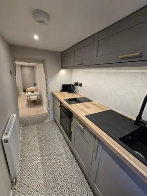 a kitchen with a sink and a counter top at Modern Retreat near Aberaeron - Luxe 1 bed Escape in Ciliau-Aeron